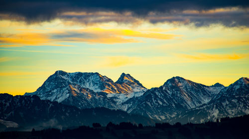 Scenic view of mountains against sky during sunset