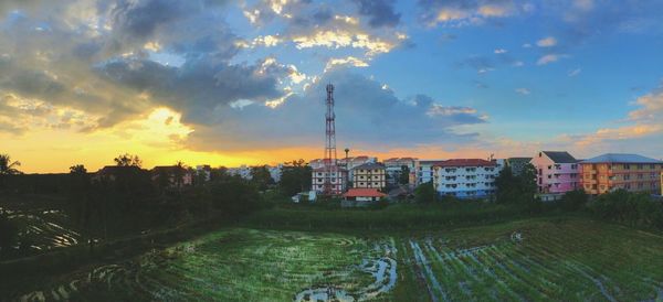 Panoramic view of city against sky during sunset