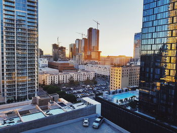 Modern buildings in city against sky