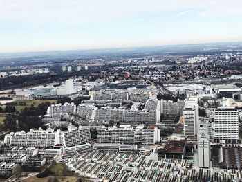 High angle view of modern buildings in city against sky