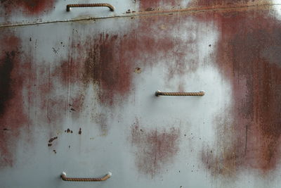 Close-up of old rusty metal door