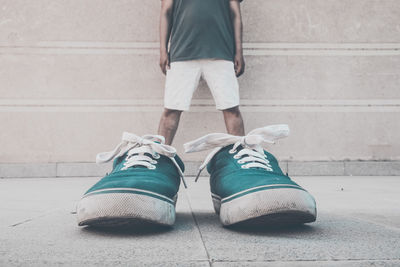 Low section of man standing on floor