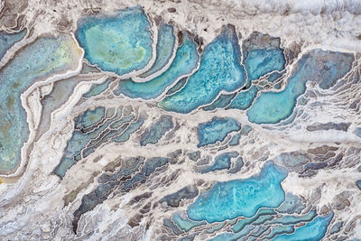 High angle view of blue water on rock