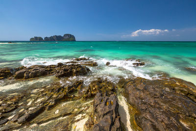 Scenic view of sea against blue sky