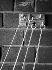 High angle view of metal hanging on wall