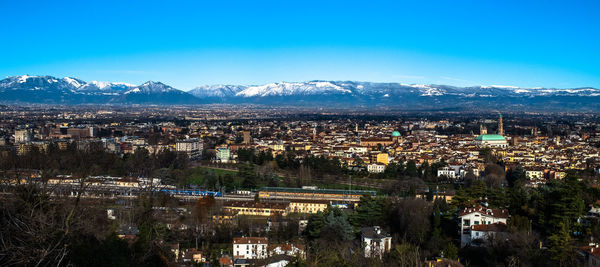 View of the venetian snow-covered pre-alps with vicenza in the foreground, italy