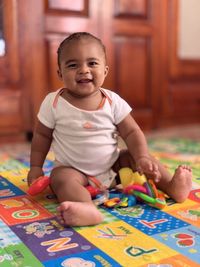 Portrait of cute baby boy with toy blocks