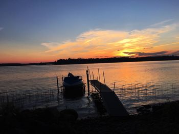 Scenic view of calm sea at sunset