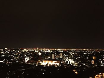 Illuminated cityscape at night