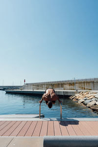 Sportsman practicing stretching and calisthenics