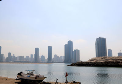 Panoramic view of river and buildings against sky