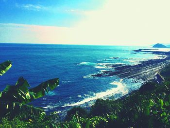 Scenic view of sea against blue sky