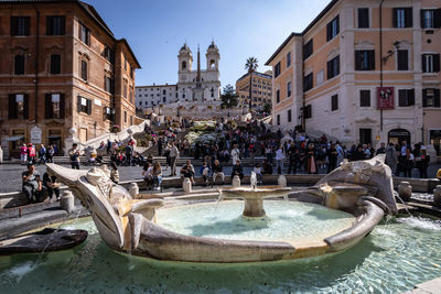 Group of people in front of buildings