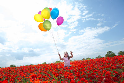 Girl playing with balloons