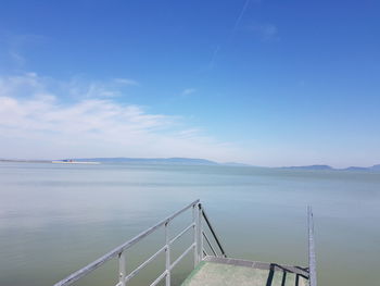 Scenic view of sea against blue sky