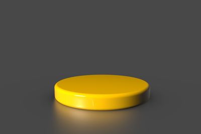 Close-up of yellow lamp over black background