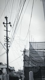 Low angle view of electricity pylon