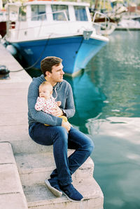 Young woman sitting on boat