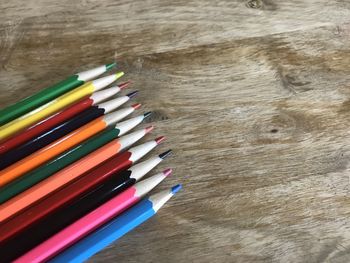 High angle view of multi colored pencils on table