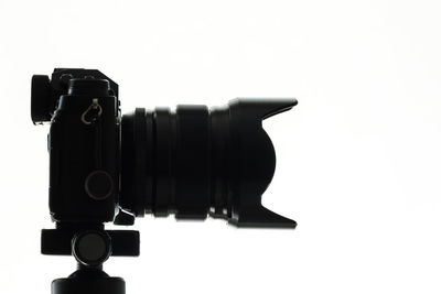 Close-up of camera against white background