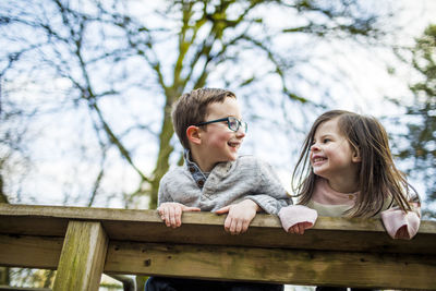 Best friends share connection via eye contact at the park.