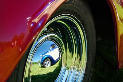 Close-up of vintage car against sky