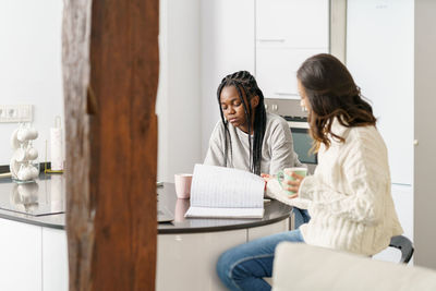 Young friends studying at home