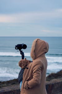 Man on beach against sky