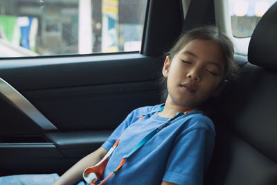 Girl sitting in car