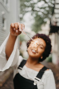 Portrait of woman holding ice cream cone