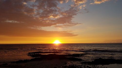 Scenic view of sunset over sea