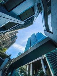 Low angle view of modern buildings against sky in city