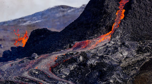 Smoke emitting from volcanic mountain at night