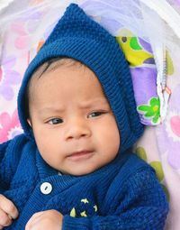 Portrait of cute baby boy in carriage