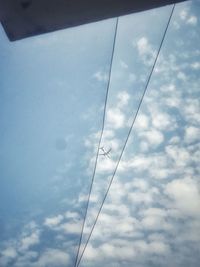 Low angle view of cables against sky