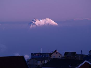 Houses with snowcapped mountain in background