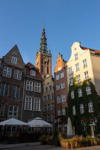 Low angle view of buildings against blue sky