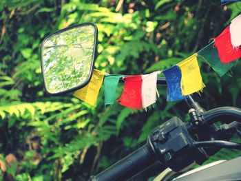 Close-up of bunting flags on motorcycle