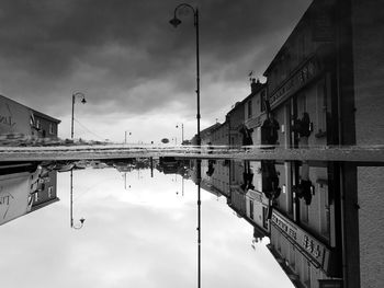 Reflection of street and buildings in canal