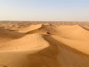 Scenic view of desert against clear sky