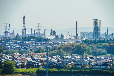 View of buildings in city against clear sky