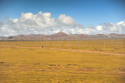 View of landscape against cloudy sky