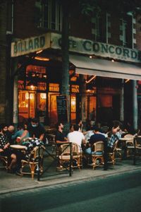 Group of people in front of building at night