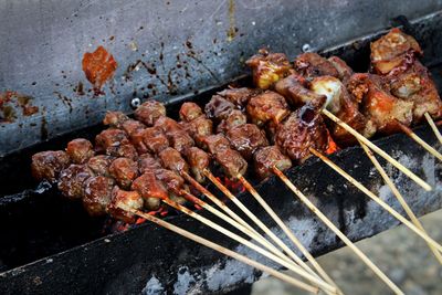 High angle view of meat on barbecue grill