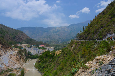 Scenic view of landscape and mountains against sky