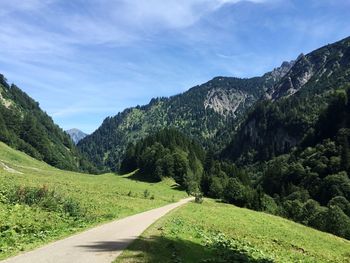 Country road leading towards mountains