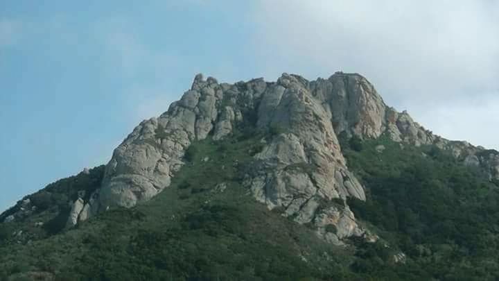 mountain, tranquility, tranquil scene, scenics, rock formation, beauty in nature, sky, nature, rocky mountains, low angle view, rock - object, geology, mountain range, non-urban scene, physical geography, landscape, idyllic, cliff, remote, rock