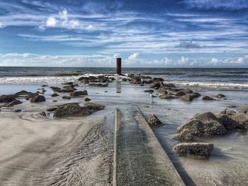 Scenic view of beach against sky