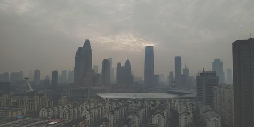 Modern buildings in city against sky