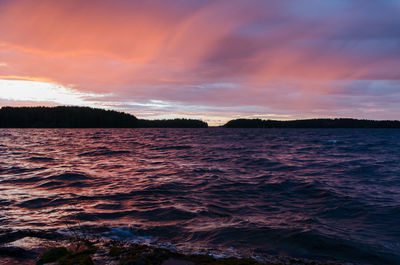 Scenic view of sea against dramatic sky